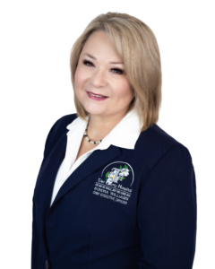 Headshot of Sondra Williams, a woman with blonde hair wearing a navy blazer over a white blouse, smiling at the camera.