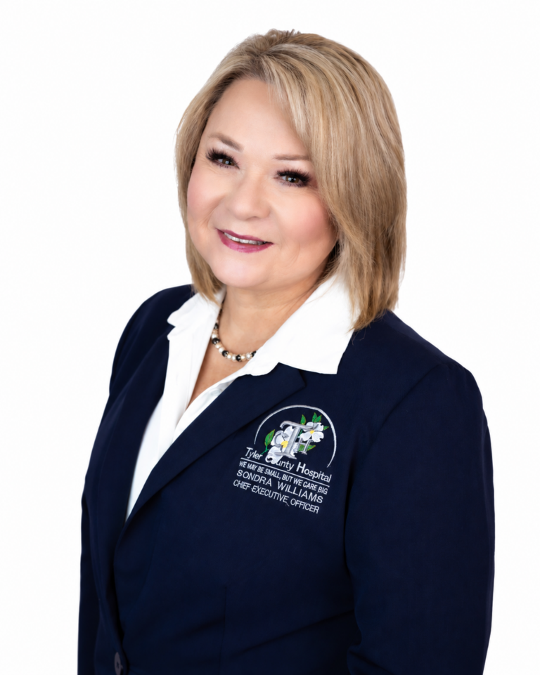 Sondra Williams, Chief Executive Officer of Tyler County Hospital, wearing a navy blue blazer with the hospital logo.